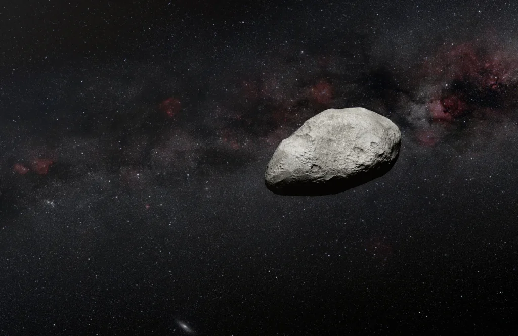 Illustration of an irregularly-shaped grey asteroid against the dark background of space.