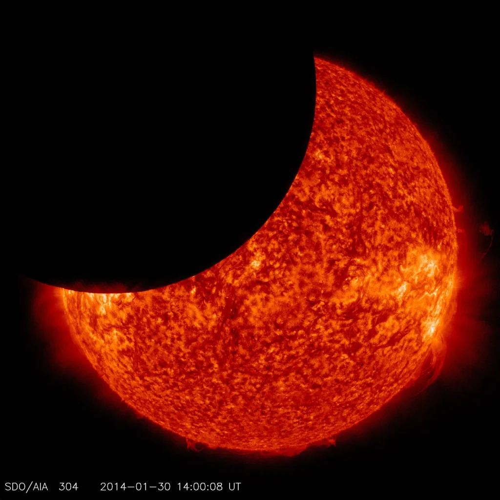 NASA's Solar Dynamics Observatory captured this image of the moon crossing in front of its view of the sun on Jan. 30, 2014, at 9:00 a.m. EST in 304 angstrom light. Credit: NASA/SDO