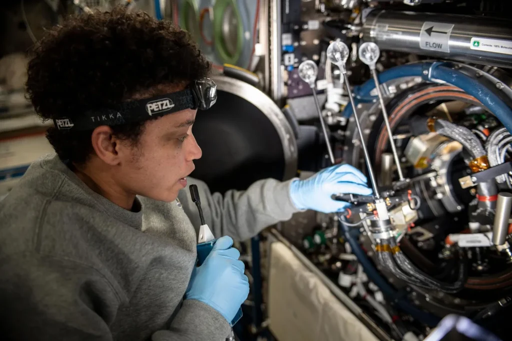 iss067e170237 (June 24, 2022) — Expedition 67 Flight Engineer and NASA astronaut Jessica Watkins services components that support the Solid Fuel Ignition and Extinction (SOFIE) fire safety experiment