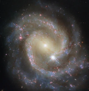 Hubble Spies Paired Pinwheel on Its Own