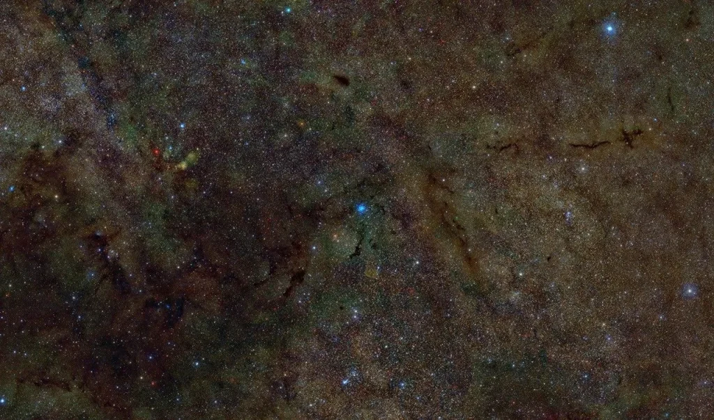 Optical, infrared, and X-ray composite image of a portion of the interstellar gas and dust with an X-ray source at the center