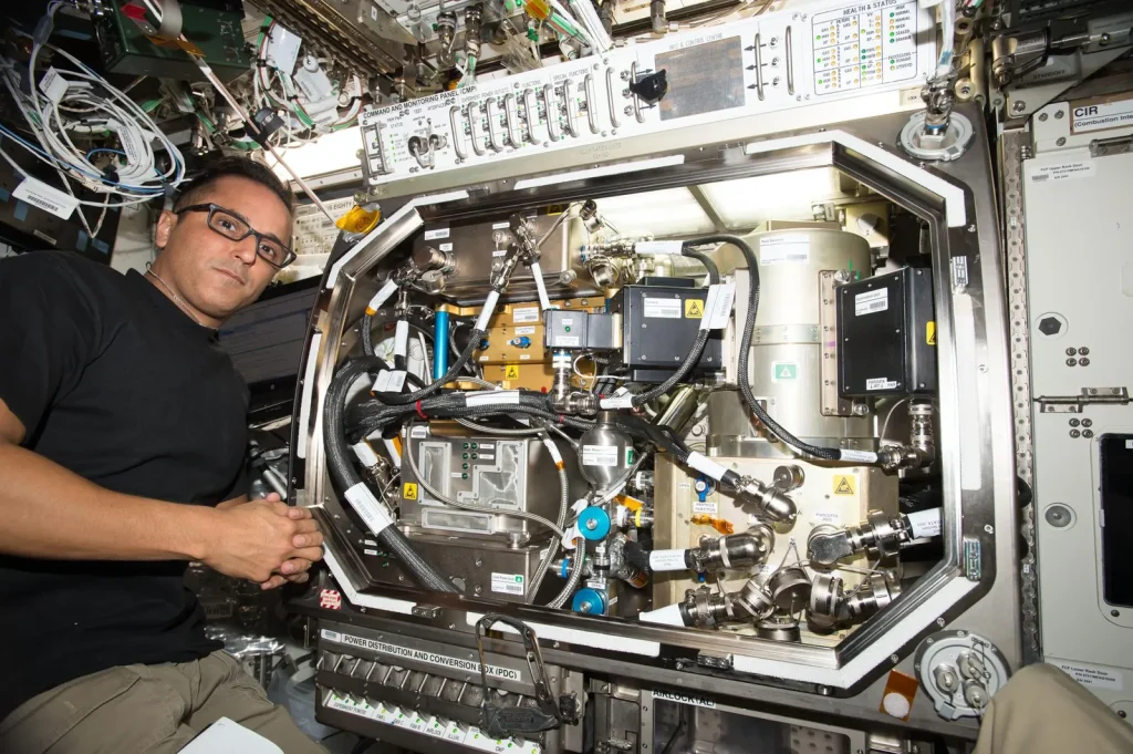 iss053e027051 (Sept. 19, 2017) — Flight Engineer Joe Acaba works in the U.S. Destiny laboratory module setting up hardware for the Zero Boil-Off Tank (ZBOT) experiment. ZBOT uses an experimental fluid