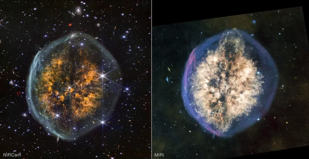 Side-by-side images of the same nebula show how differently it appears in near-infrared, on the left, versus mid-infrared light, on the right. Left image is labeled NIRCam and the right is labeled MIRI.

In near-infrared, the nebula’s outer bubble has a white edge and its inner clouds are orange, with a distinct dark lane cutting vertically through the center. Stars and background galaxies appear around the nebula and through the outer bubble.

In mid-infrared, the outer bubble has a bluish tint and there is more material in the inner clouds, which are colored off-white. The vertical dark lane is still present but more interrupted and covered by the clouds. Material appears to be erupting out the top of the nebula, and this effect is mirrored to a lesser degree at the bottom, opposite end.