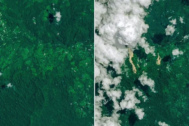 A narrow, light-brown landslide scar cuts through dark green forested mountains in East New Britain and extends north toward a stream valley. Rivers swollen with floodwaters, areas of forest clearing, and scattered clouds are also visible in some parts of the image.